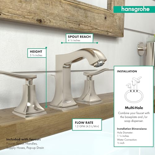 Polished nickel widespread faucet with two lever handles, curved spout, and matching pop-up drain installed on bathroom sink.