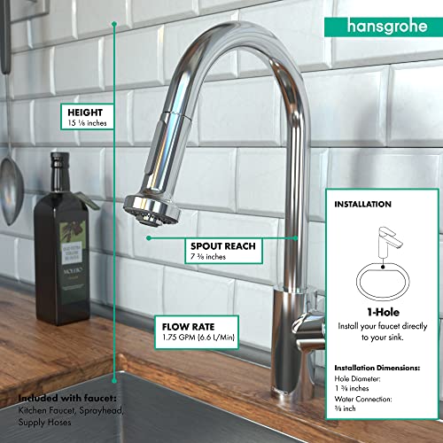 Polished nickel pull-down kitchen faucet with curved spout and spray head over sink with white subway tile backsplash.