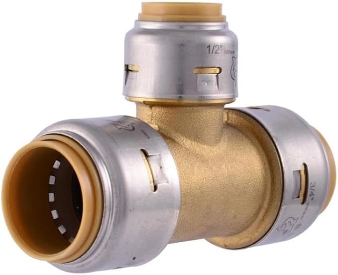 Brass reducing tee fitting with three push-connect ports in different sizes, silver compression rings, and marking indicating