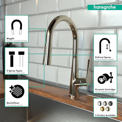Polished nickel high-arc kitchen faucet with pull-down spray head mounted on sink.