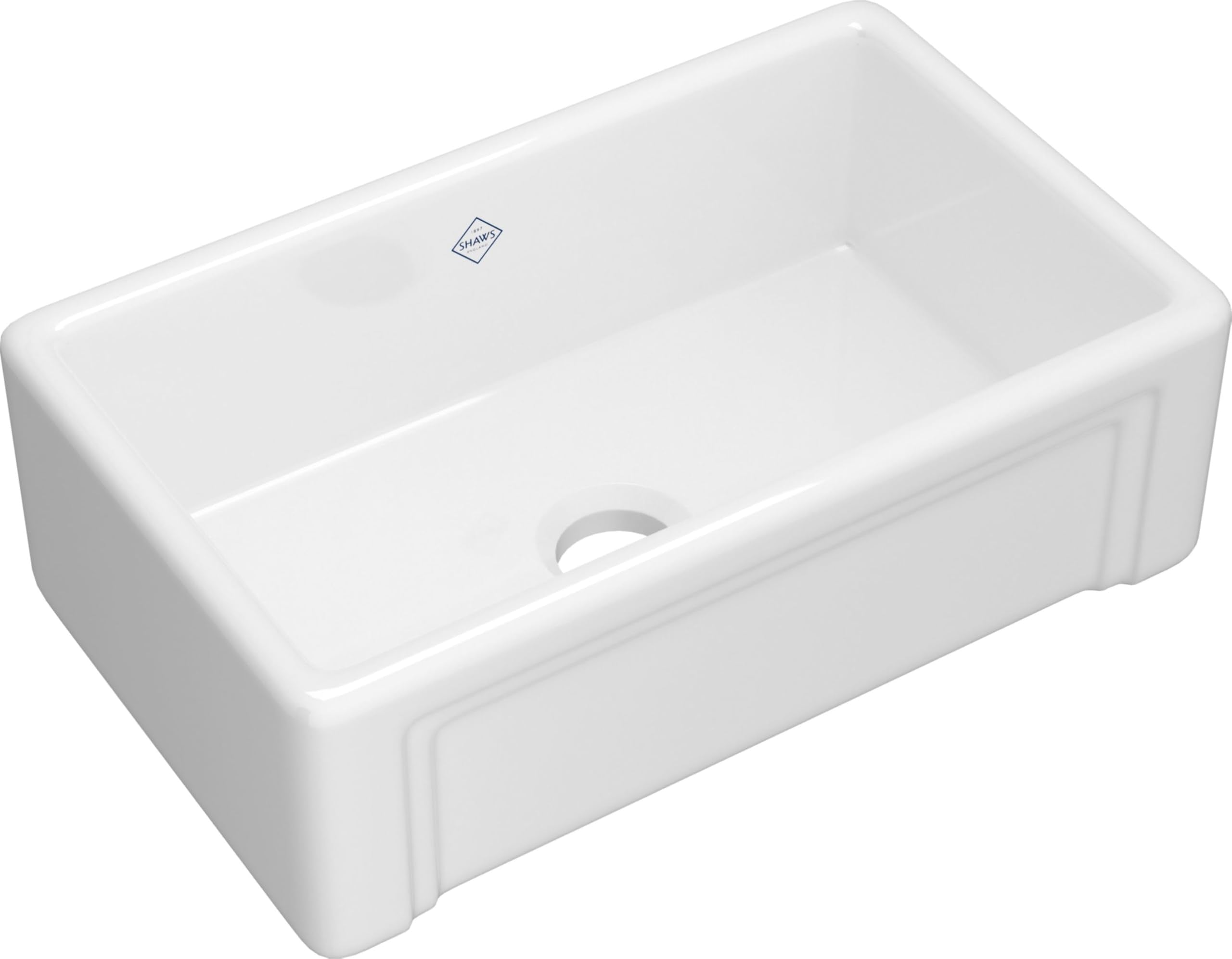 White fireclay farmhouse apron front kitchen sink with single bowl and drain opening.