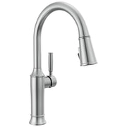 Stainless steel single-handle pull-down kitchen faucet with curved spout and spray head in extended position.