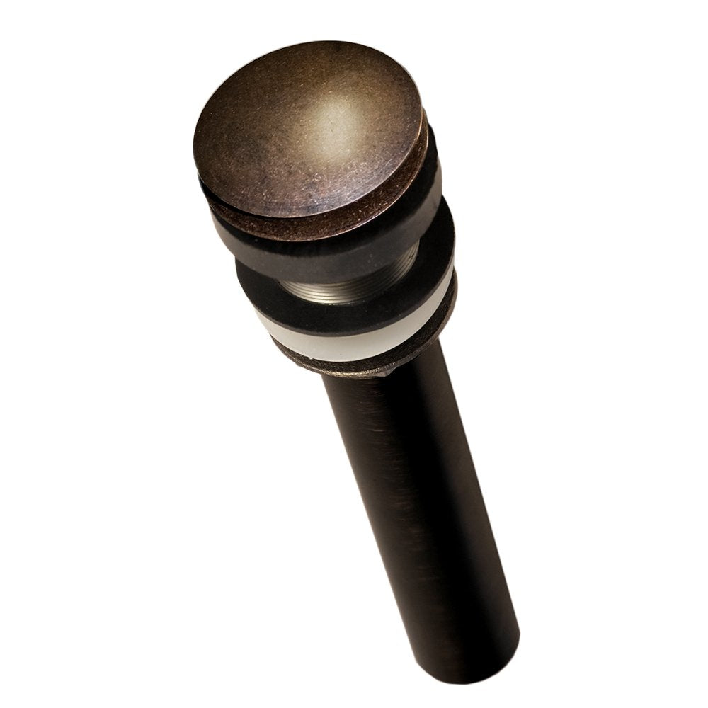 Weathered copper dome drain with push-to-seal mechanism and black cylindrical body with rubber bands.
