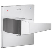 Chrome square valve trim with Delta branding, red and blue indicator dots, and angular lever handle.