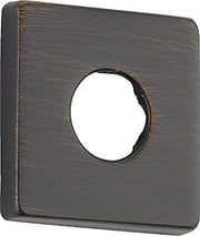 Square shower flange in dark bronze finish with circular opening and brushed texture.