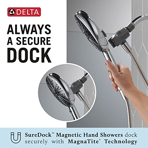 Chrome hand shower with magnetic dock attachment held in hand with hose connection visible.