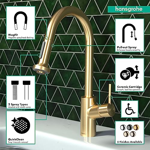 Brushed gold pull-down kitchen faucet with high arc spout and single handle on green tile backsplash.