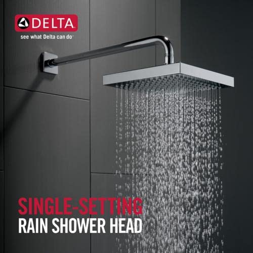 Chrome raincan shower head with single-setting spray mounted on black wall arm with water flowing downward.