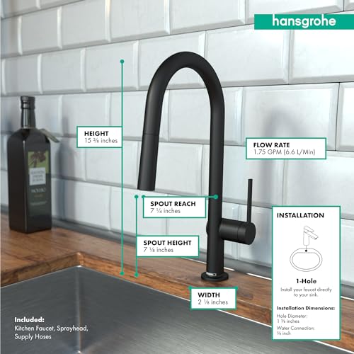 Matte black high-arc kitchen faucet with pull-down sprayer mounted on wooden countertop against white subway tile backsplash.