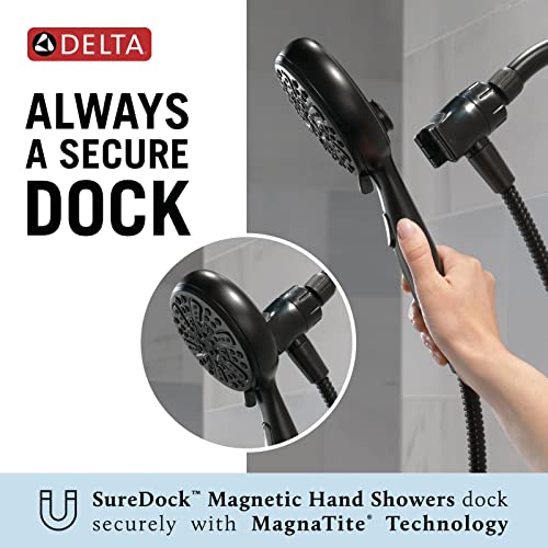 Black handheld shower head with six spray settings and magnetic dock holder, shown mounted on wall and held in hand.