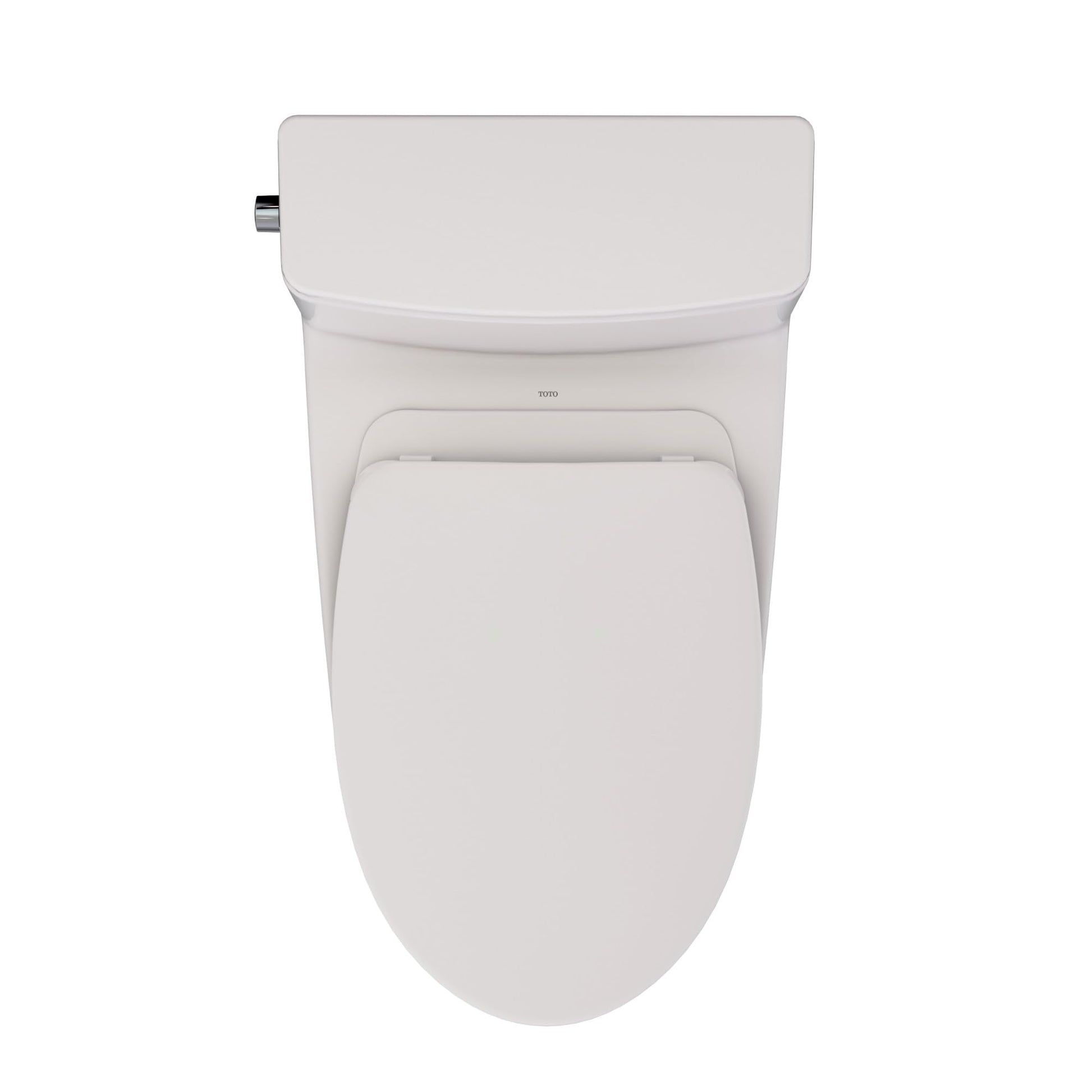 Sedona beige one-piece elongated toilet with closed seat and chrome water supply connector on left side.