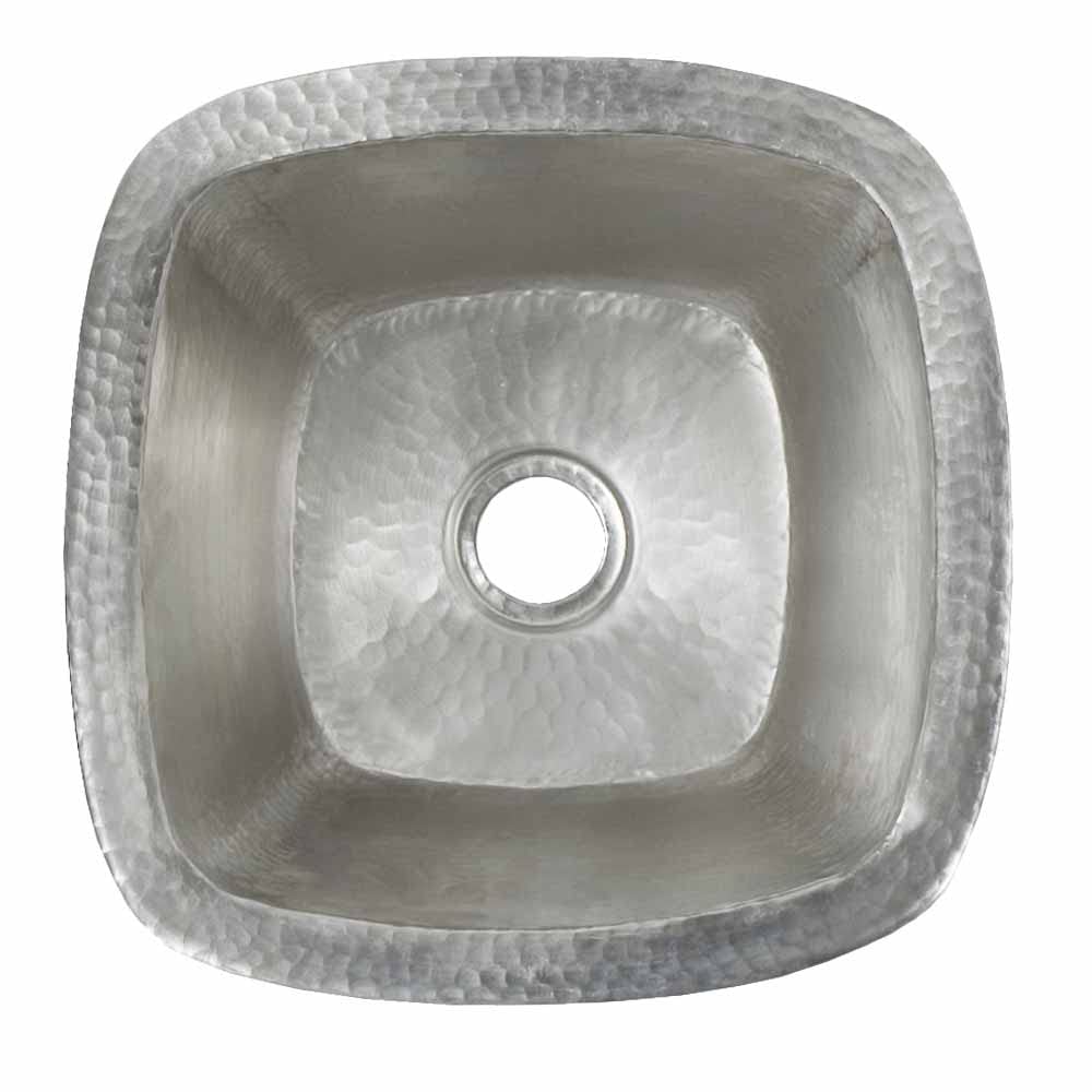 Small square hammered copper bar sink with rounded corners and single drain hole, viewed from above.