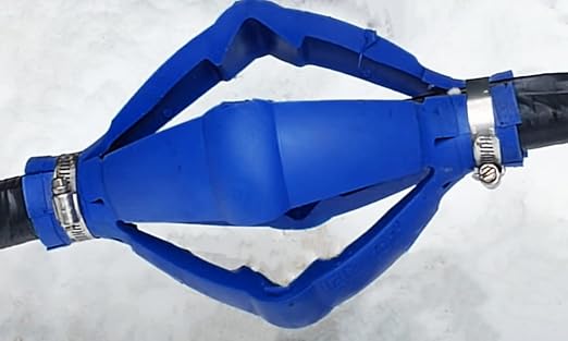 Blue torque arrestor with metal clamps attached to black pipes on light background.