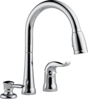 Chrome pull-down kitchen faucet with single handle and matching soap dispenser pump.