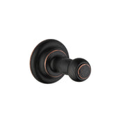 Rubbed bronze wall-mounted hook with round backplate and cylindrical hook arm.