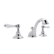 Polished chrome widespread lavatory faucet with curved center spout and white porcelain lever handles on round bases.