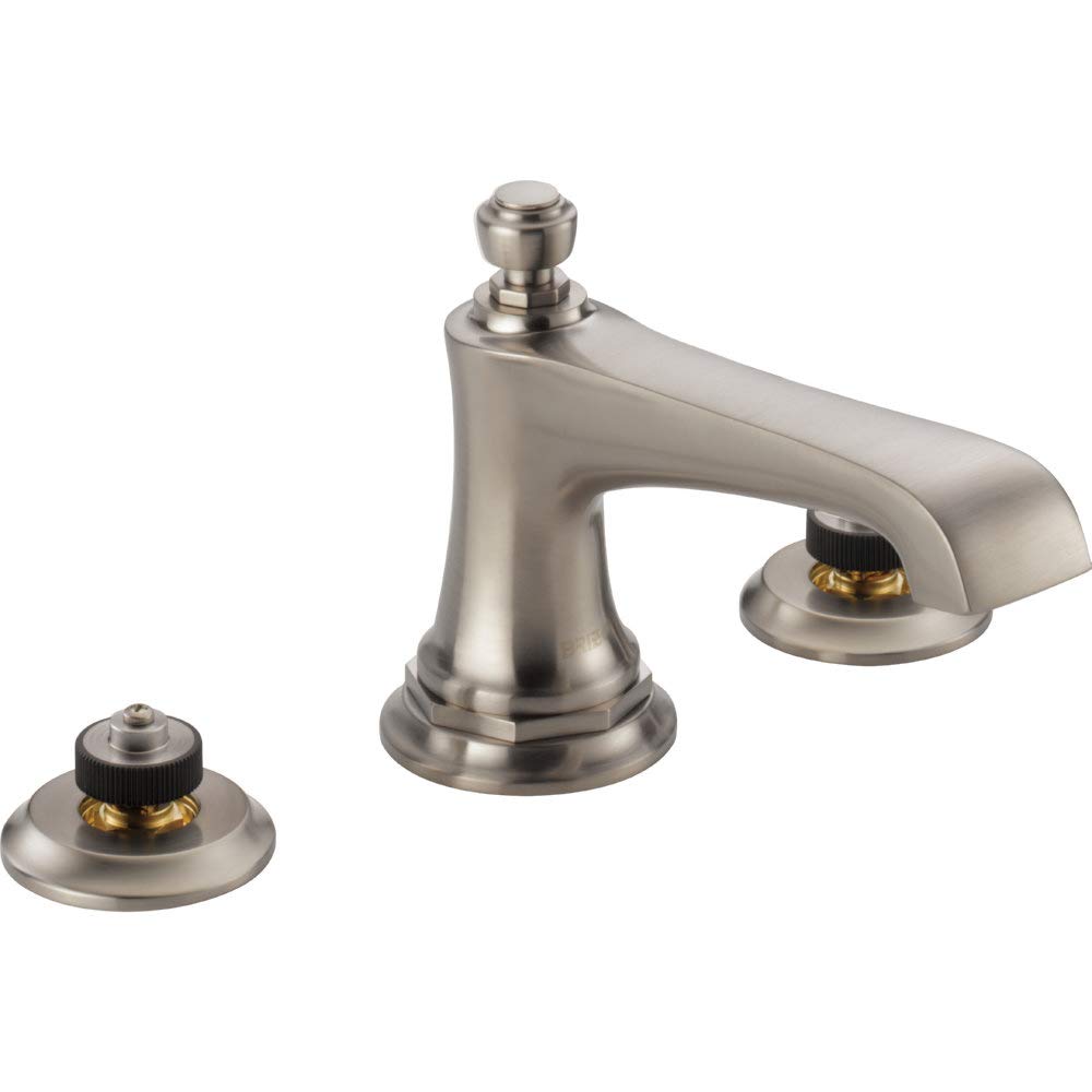 Brushed nickel widespread lavatory faucet with spout and two valve bases featuring black knobs and brass accents.