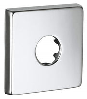 Chrome escutcheon with square face plate and circular opening for wall-mounted pipe fitting.