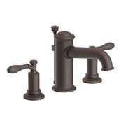 Oil-rubbed bronze widespread lavatory faucet with dual handles and central spout on round bases.