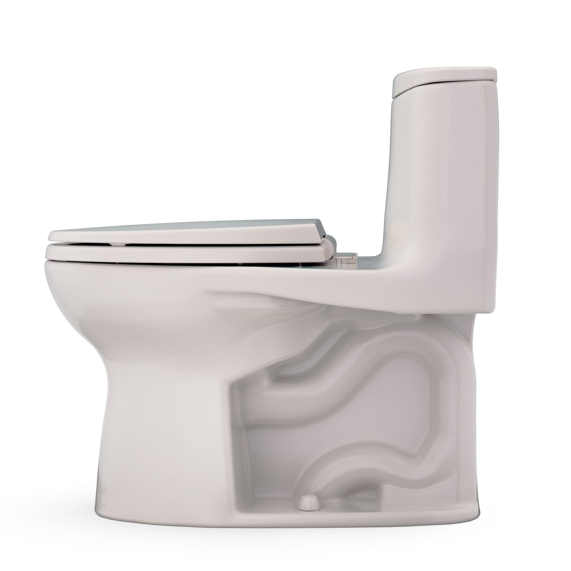 Sedona beige one-piece elongated toilet with soft-close seat and integrated tank in side view.