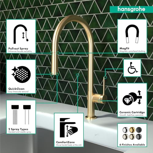 Brushed gold optic high-arc kitchen faucet with pull-down spray head over white countertop.