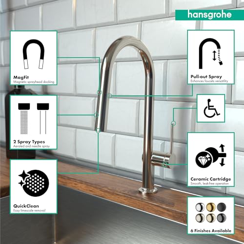 Polished nickel high arc kitchen faucet with pull-down spray head and curved spout over sink.