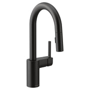 Matte black single-handle pulldown kitchen faucet with curved spout and docking sprayer.