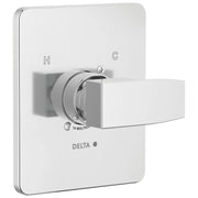 Chrome Delta monitor valve with rounded square trim plate and lever handle, H and C markings visible.