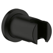 Matte black wall-mounted hand shower holder with cylindrical grip and circular mounting plate.