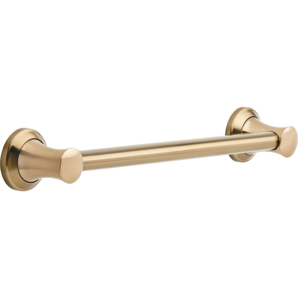 Brushed champagne bronze grab bar with cylindrical handles on each end mounted horizontally.