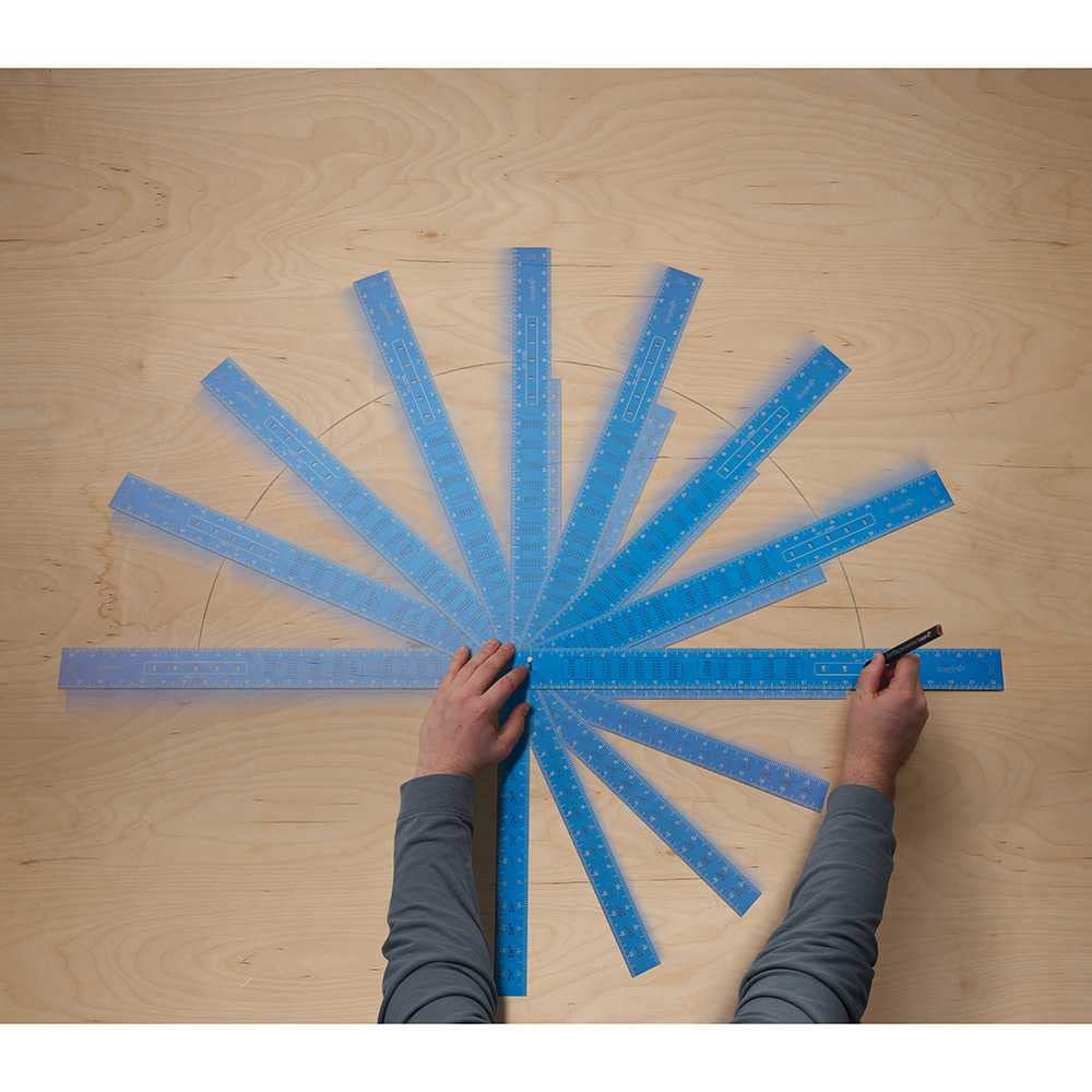 Blue laser-etched framing square with measurement markings arranged in a radial pattern on wood surface.