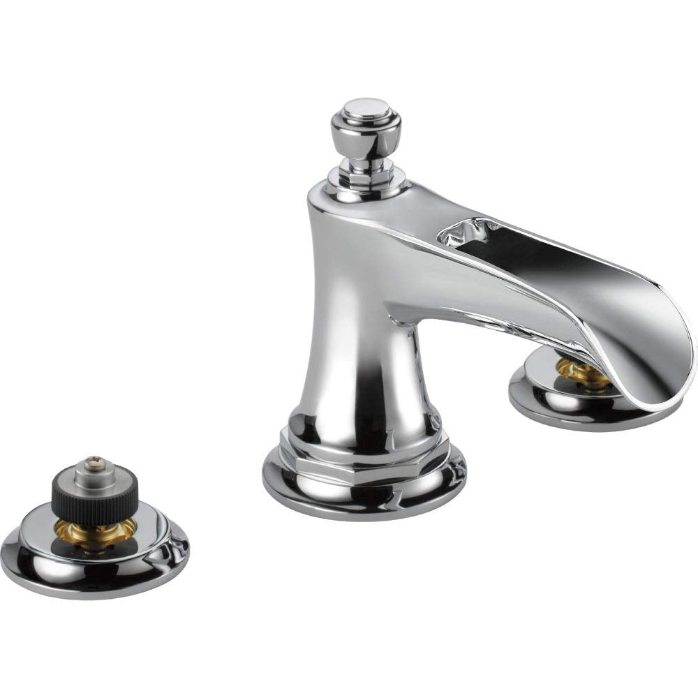 Chrome widespread lavatory faucet with curved channel spout and two control handles with brass accents.