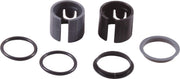 Two cylindrical retainer rings with slotted tops and four rubber O-rings in varying sizes.