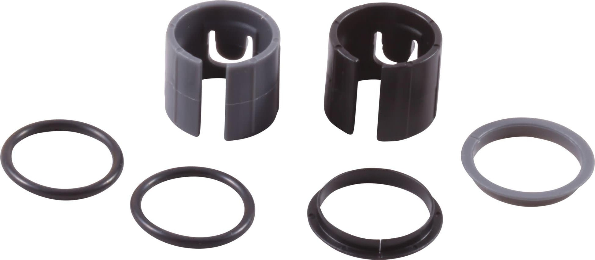 Two cylindrical retainer rings with slotted tops and four rubber O-rings in varying sizes.