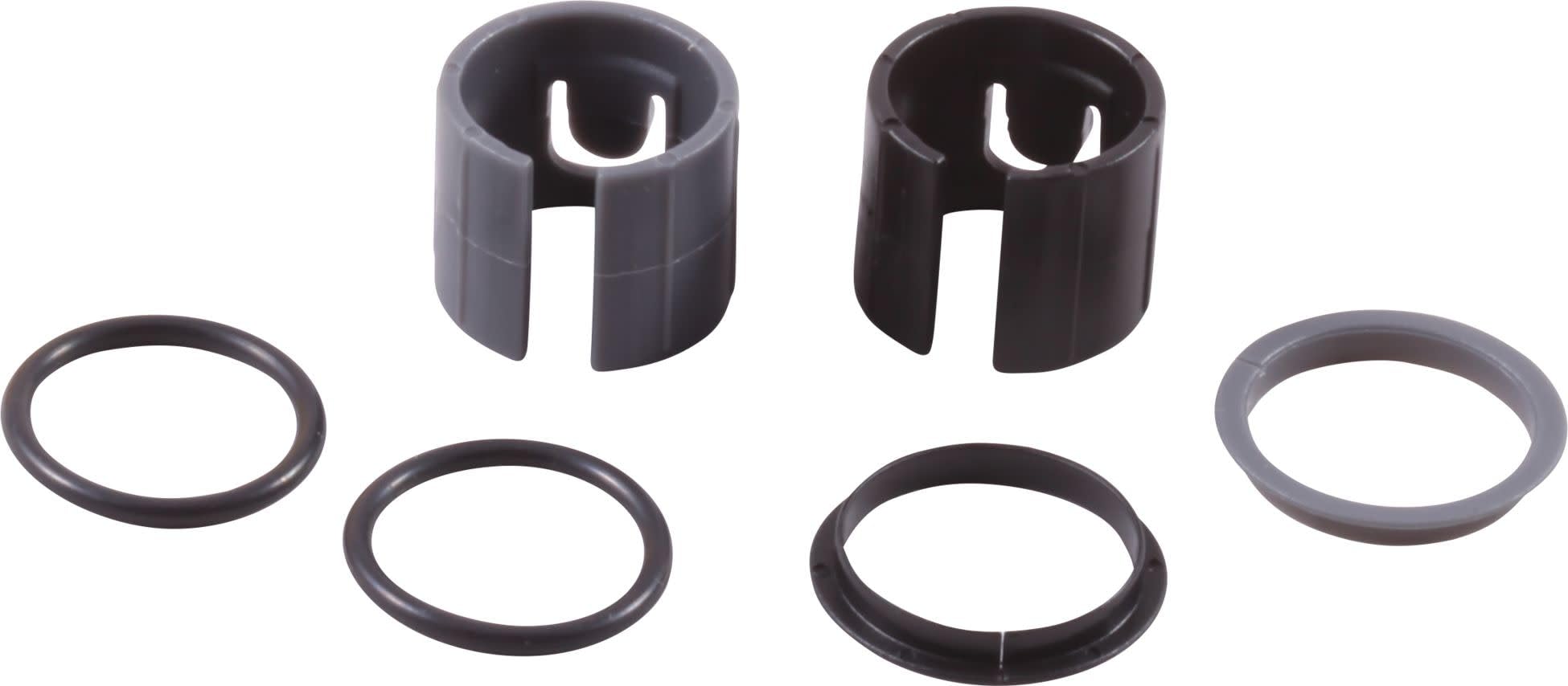 Two cylindrical retainer rings with slotted tops and four rubber O-rings in varying sizes.