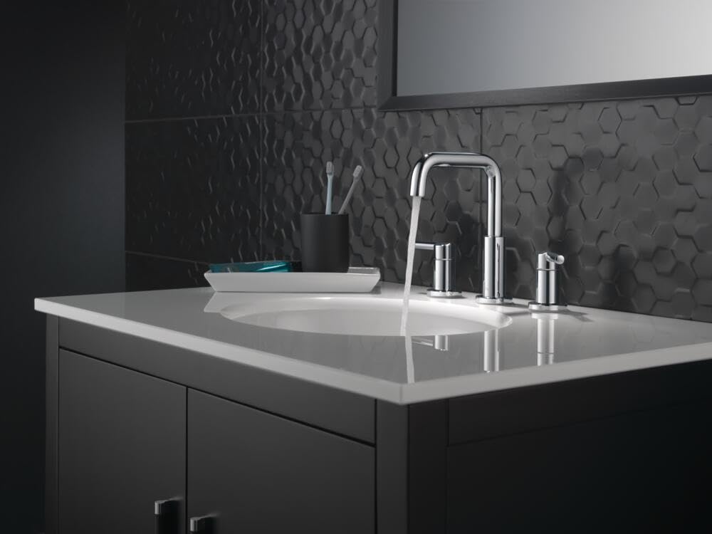 Chrome two-handle widespread bathroom faucet with tall curved spout installed on white countertop sink.