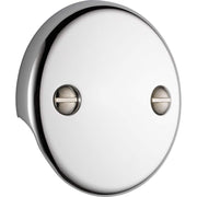 Chrome overflow plate with two holes and recessed oval screw covers, mounted on white background.