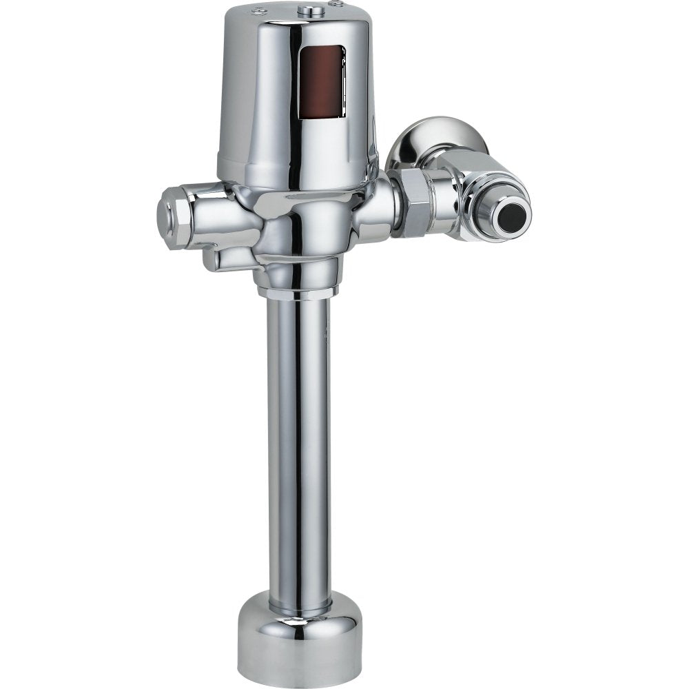Chrome commercial flush valve with cylindrical body, side lever, and floor-mounted base.
