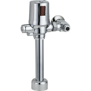 Chrome commercial flush valve with cylindrical body, side lever, and floor-mounted base.