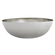Oval hammered copper vessel sink with antique finish and textured surface.