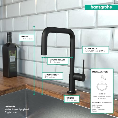 Matte black U-shaped kitchen faucet with pull-down sprayer mounted on wooden countertop against white subway tile backsplash.