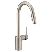 Stainless steel kitchen faucet with high curved spout and single handle lever, pulldown spray head partially extended.