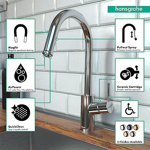 Chrome high-arc kitchen faucet with pull-down spray head and single handle, installed above sink with white subway tile backs