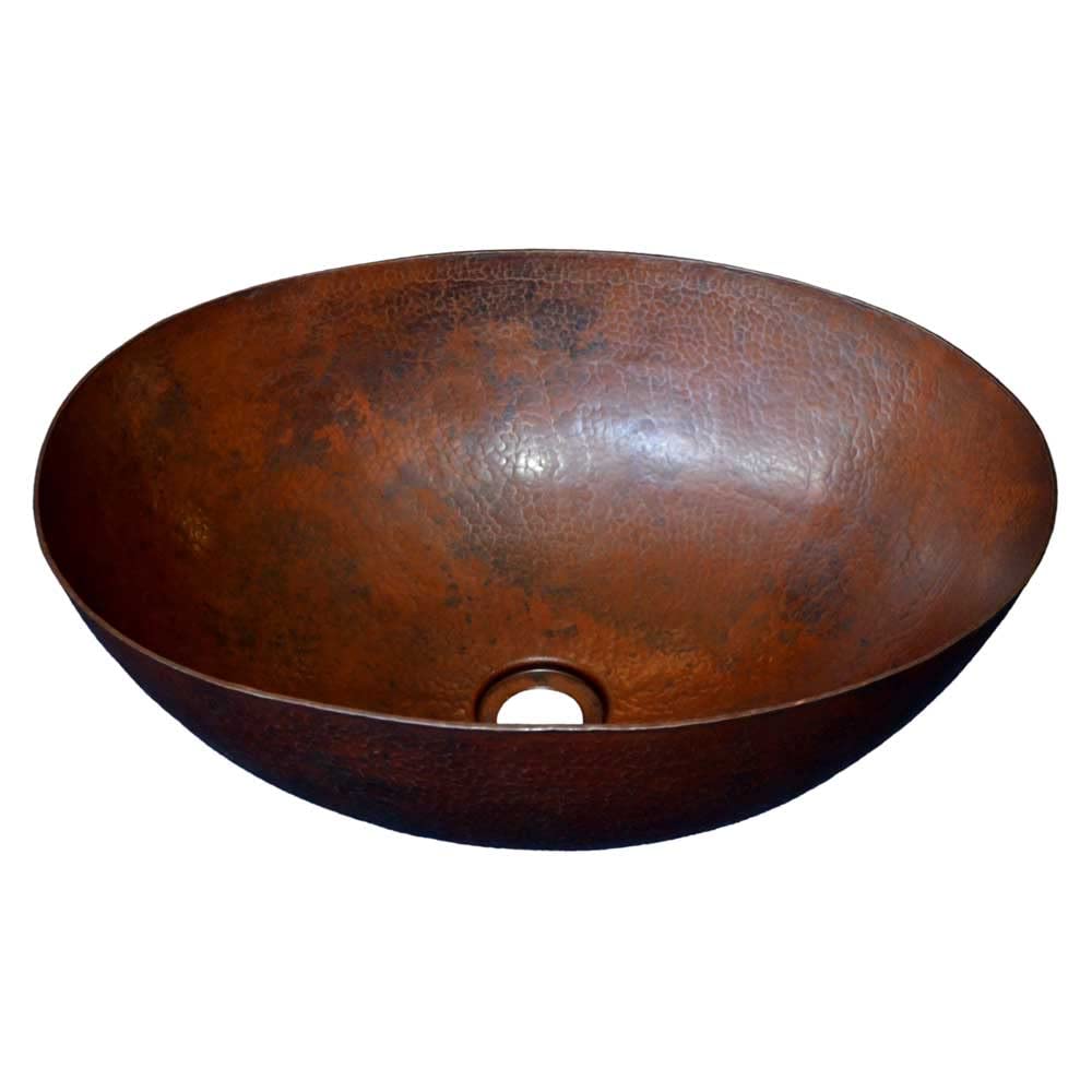 Oval copper bathroom sink with antique patina finish and drain hole.
