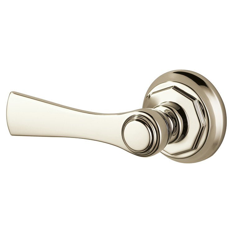 Polished nickel toilet flush lever with curved handle and circular mounting plate.