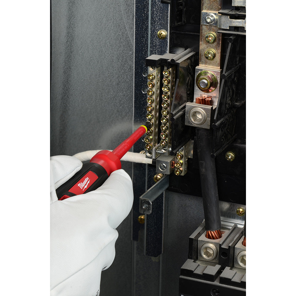 Red and black insulated screwdriver with #1 ECX tip being used on brass electrical terminal block.