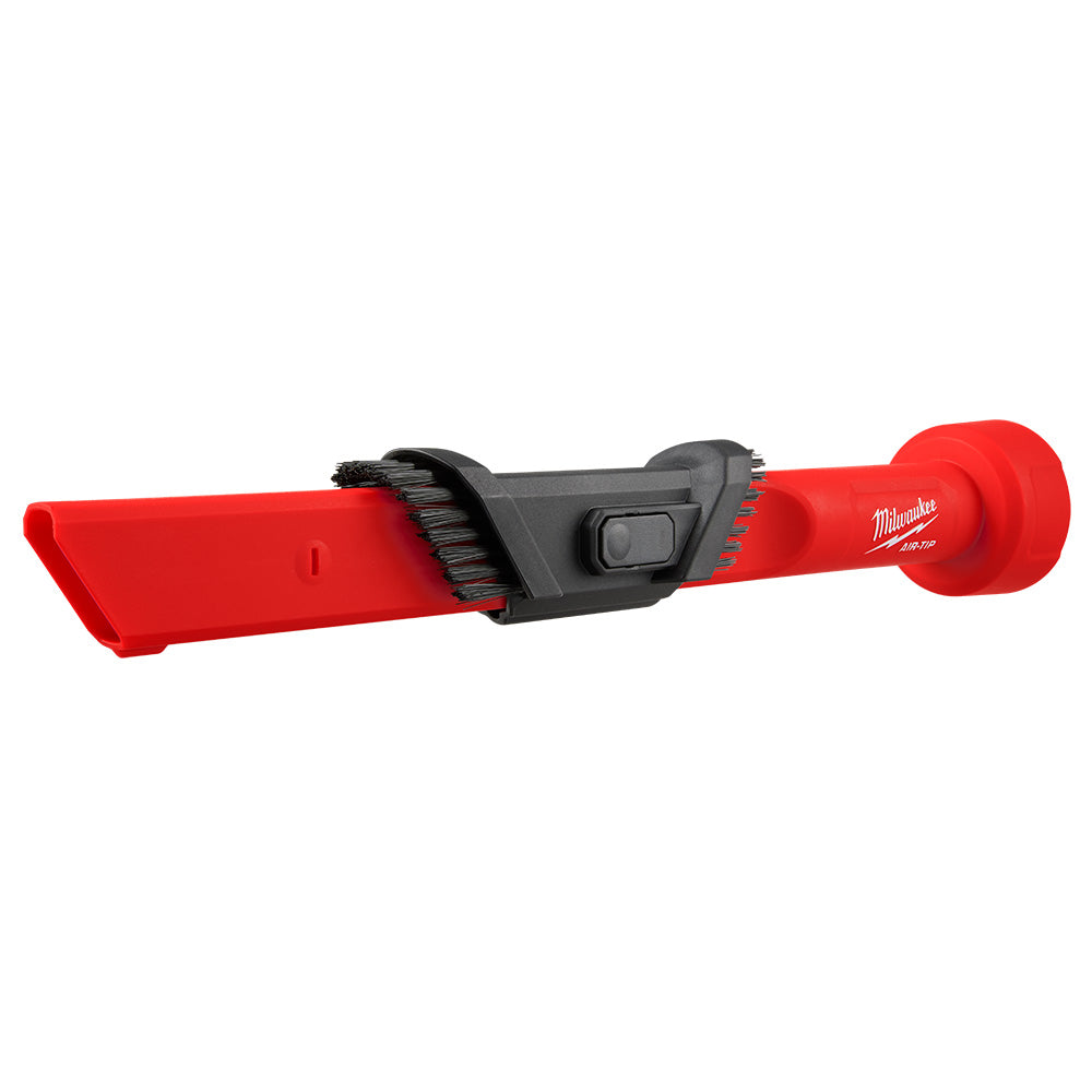 Red and black multi-function vacuum attachment with flat crevice tool on left, brush head in center, and round brush on right