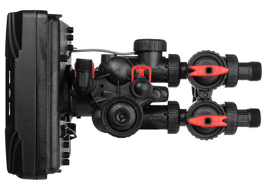Black filtration tank with dual red valve controls and black piping connections for whole house water system.