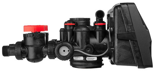 Black water filtration system components with red valve handles, control heads, and black housing tank displayed with case.