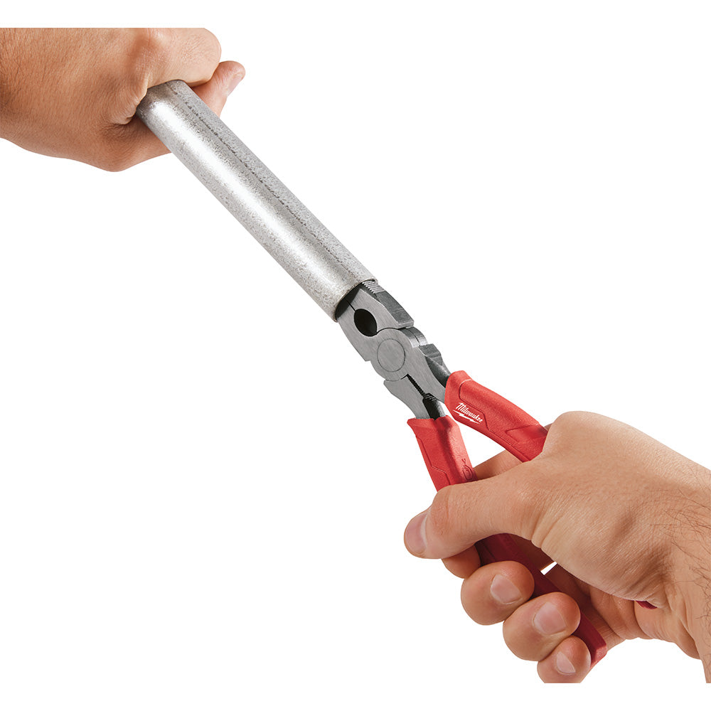 Long nose pliers with metal shaft and red handles held in two hands against white background.